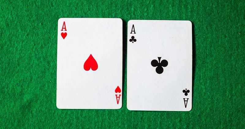 ace of hearts and ace of clubs playing cards