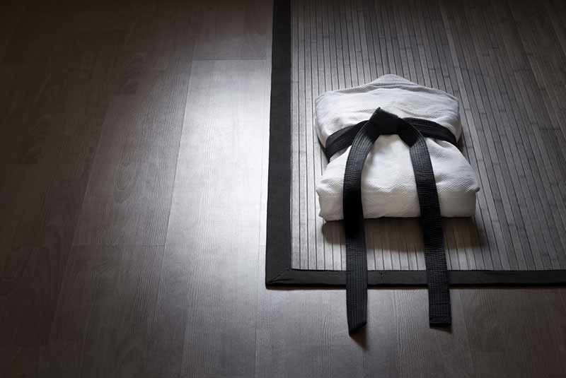 karate uniform, folded on a mat